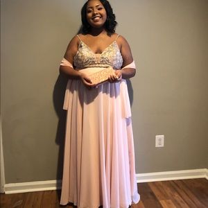 Pink glittery prom dress with spaghetti straps.